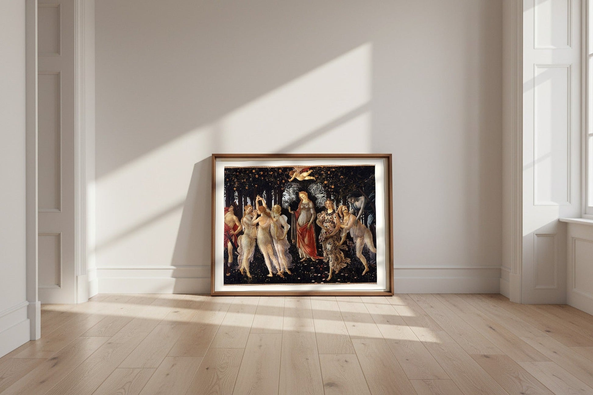 Primavera — Sandro Botticelli Fine Art Poster shown framed and leaning against a wall in a sunlit room