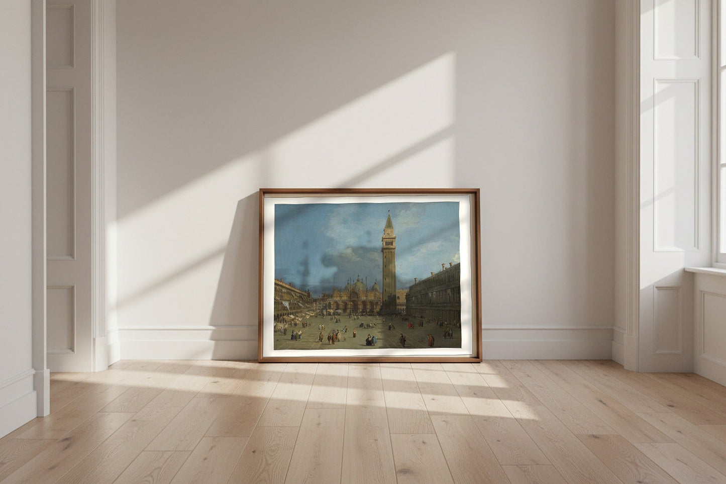 Piazza San Marco — Canaletto Fine Art Poster shown framed and leaning against a wall in a sunlit room