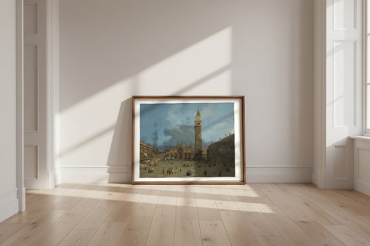Piazza San Marco — Canaletto Fine Art Poster shown framed and leaning against a wall in a sunlit room