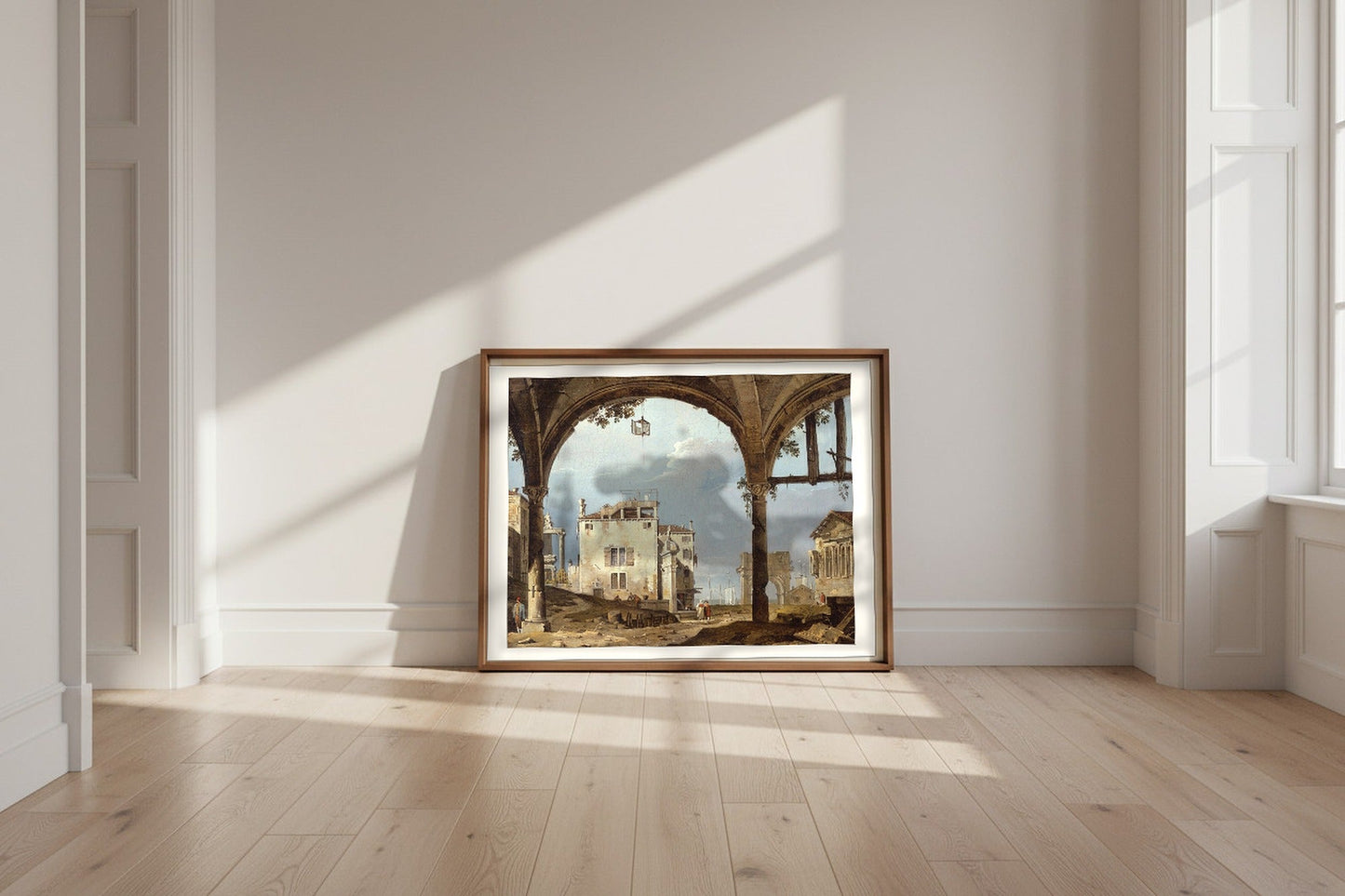 Portico with a Lantern (follower of Canaletto) Fine Art Poster shown framed and leaning against a wall in a sunlit room