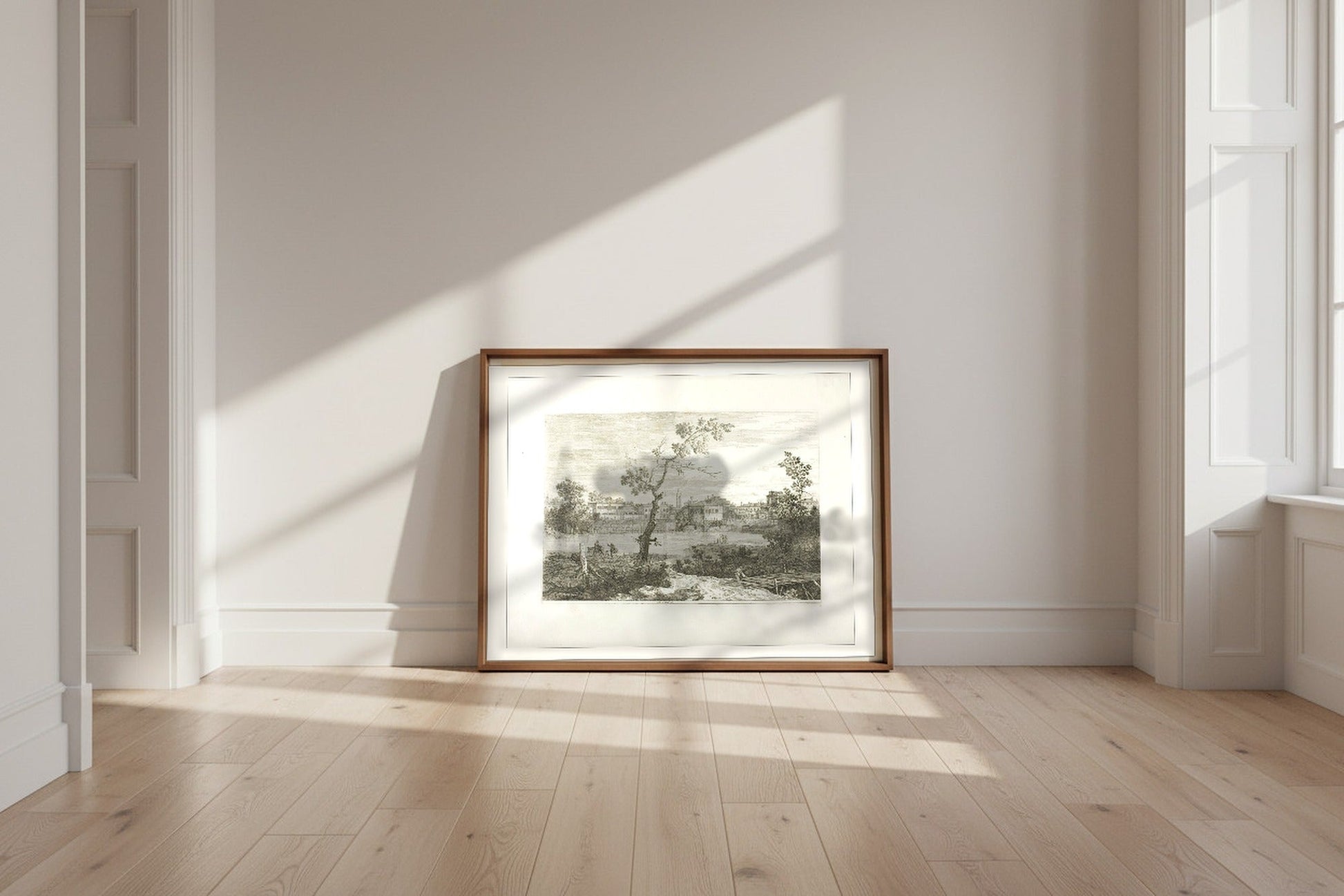 View of a Town on a River Bank — Canaletto Fine Art Poster shown framed and leaning against a wall in a sunlit room