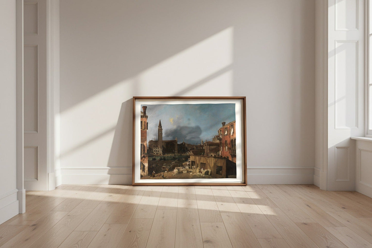 The Stonemason's Yard — Canaletto Fine Art Poster shown framed and leaning against a wall in a sunlit room