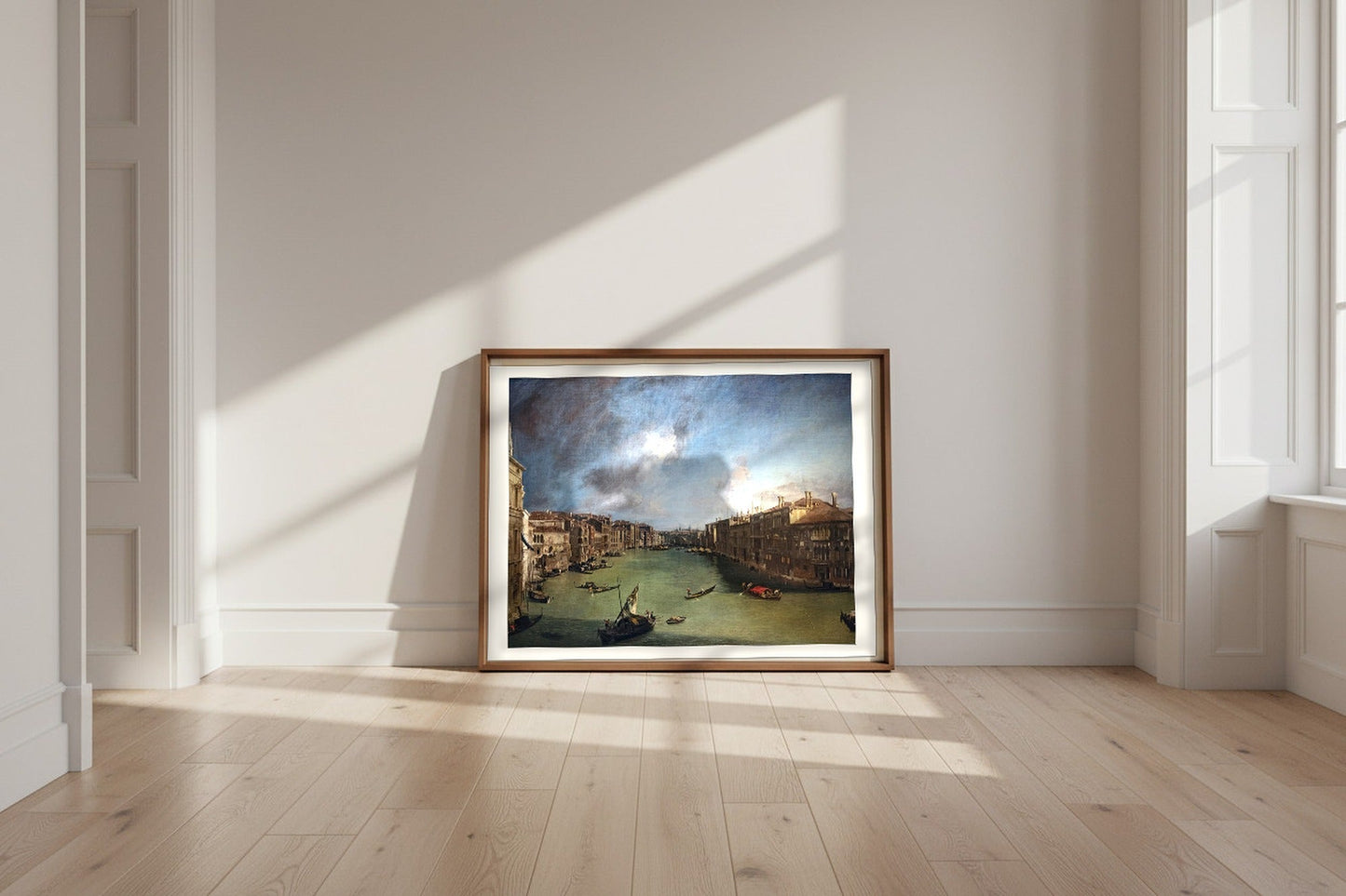 The Grand Canal from Palazzo Balbi to the Rialto — Canaletto Fine Art Poster shown framed and leaning against a wall in a sunlit room