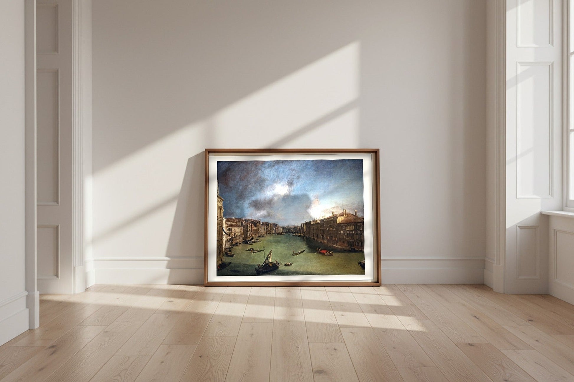 The Grand Canal from Palazzo Balbi to the Rialto — Canaletto Fine Art Poster shown framed and leaning against a wall in a sunlit room