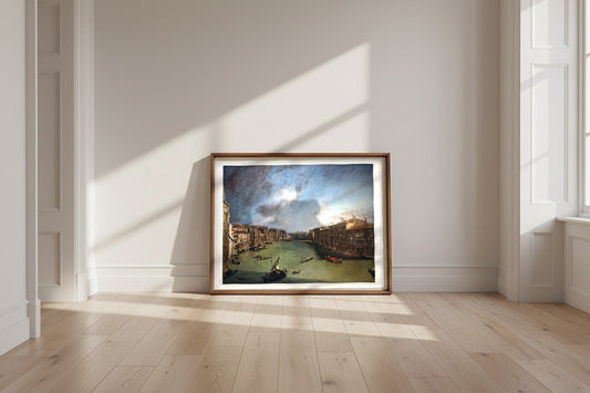 The Grand Canal from Palazzo Balbi to the Rialto — Canaletto Fine Art Poster shown framed and leaning against a wall in a sunlit room