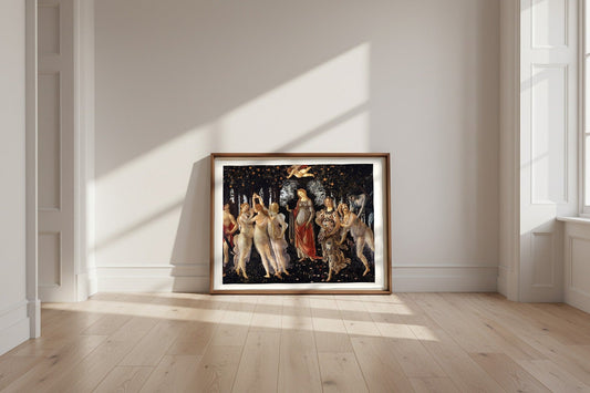 Primavera — Sandro Botticelli Fine Art Poster shown framed and leaning against a wall in a sunlit room