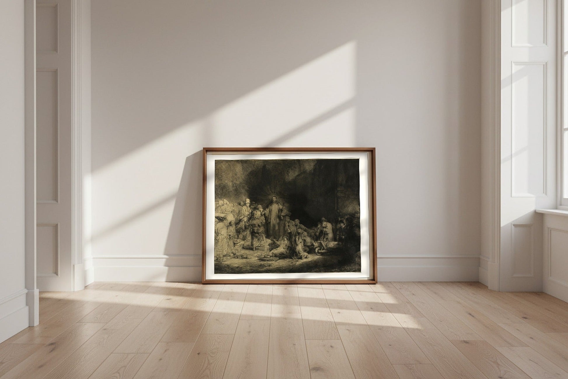 The Hundred Guilder Print — Rembrandt van Rijn Fine Art Poster shown framed and leaning against a wall in a sunlit room