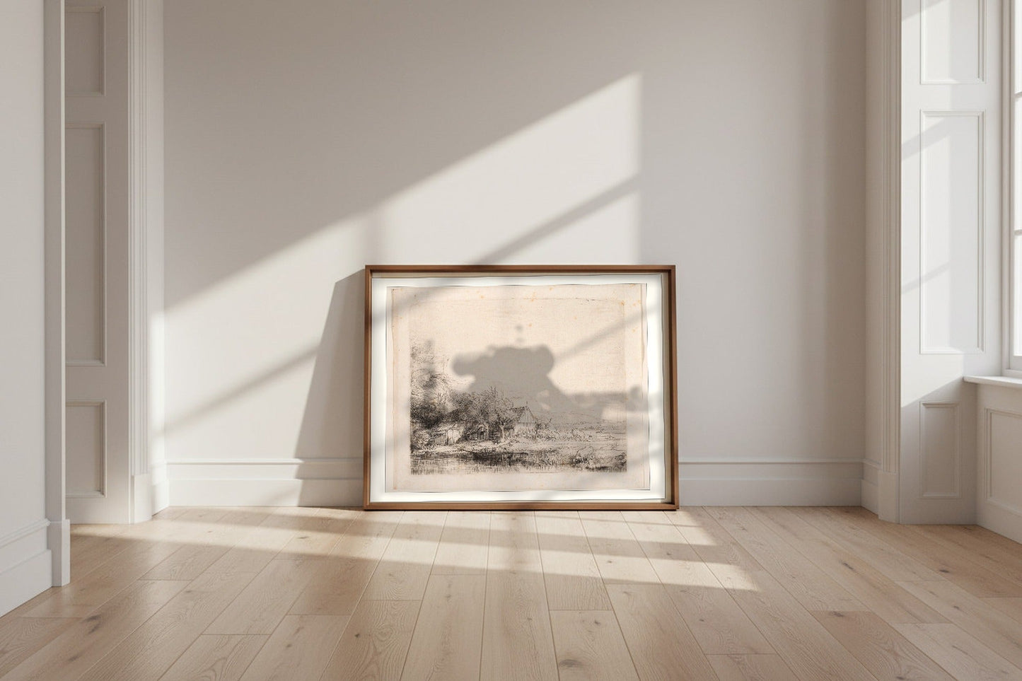 Landscape with a Cow Drinking — Rembrandt van Rijn Fine Art Poster shown framed and leaning against a wall in a sunlit room