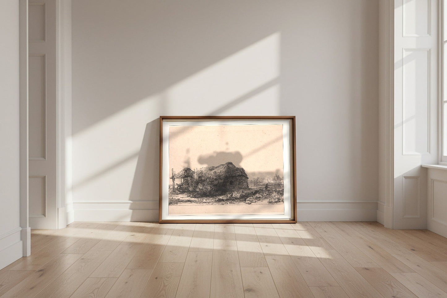 Landscape with Cottages and a Hay Barn (Oblong) — Rembrandt van Rijn Fine Art Poster shown framed and leaning against a wall in a sunlit room