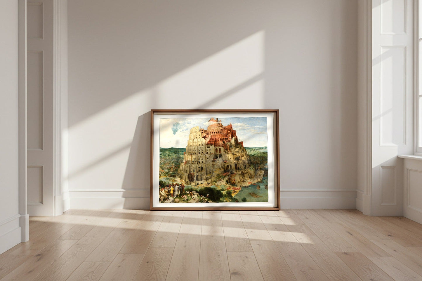 The Tower of Babel (Vienna) — Pieter Bruegel the Elder Fine Art Poster shown framed and leaning against a wall in a sunlit room