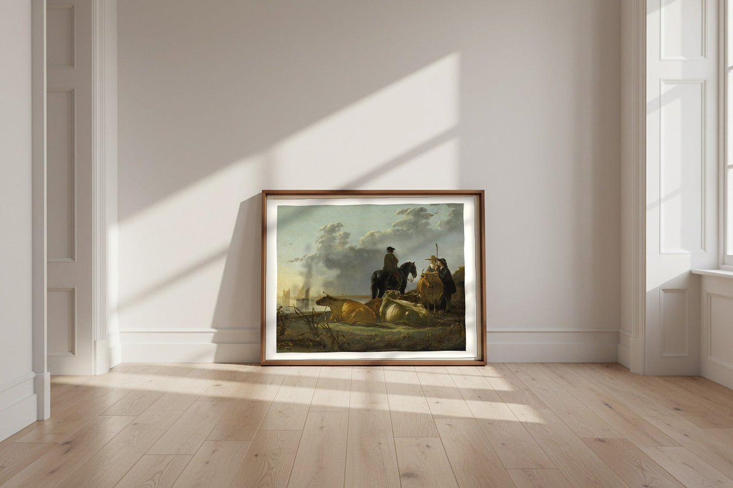Peasants with Four Cows by the River Merwede — Aelbert Cuyp Fine Art Poster shown framed and leaning against a wall in a sunlit room