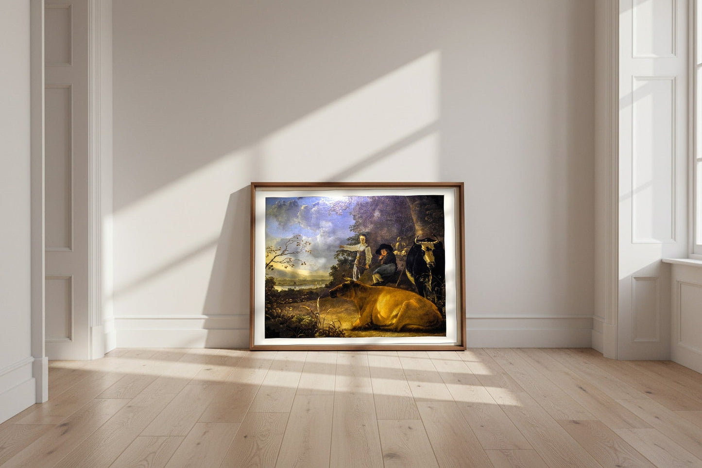 Cattle with Shepherds — Aelbert Cuyp Fine Art Poster shown framed and leaning against a wall in a sunlit room
