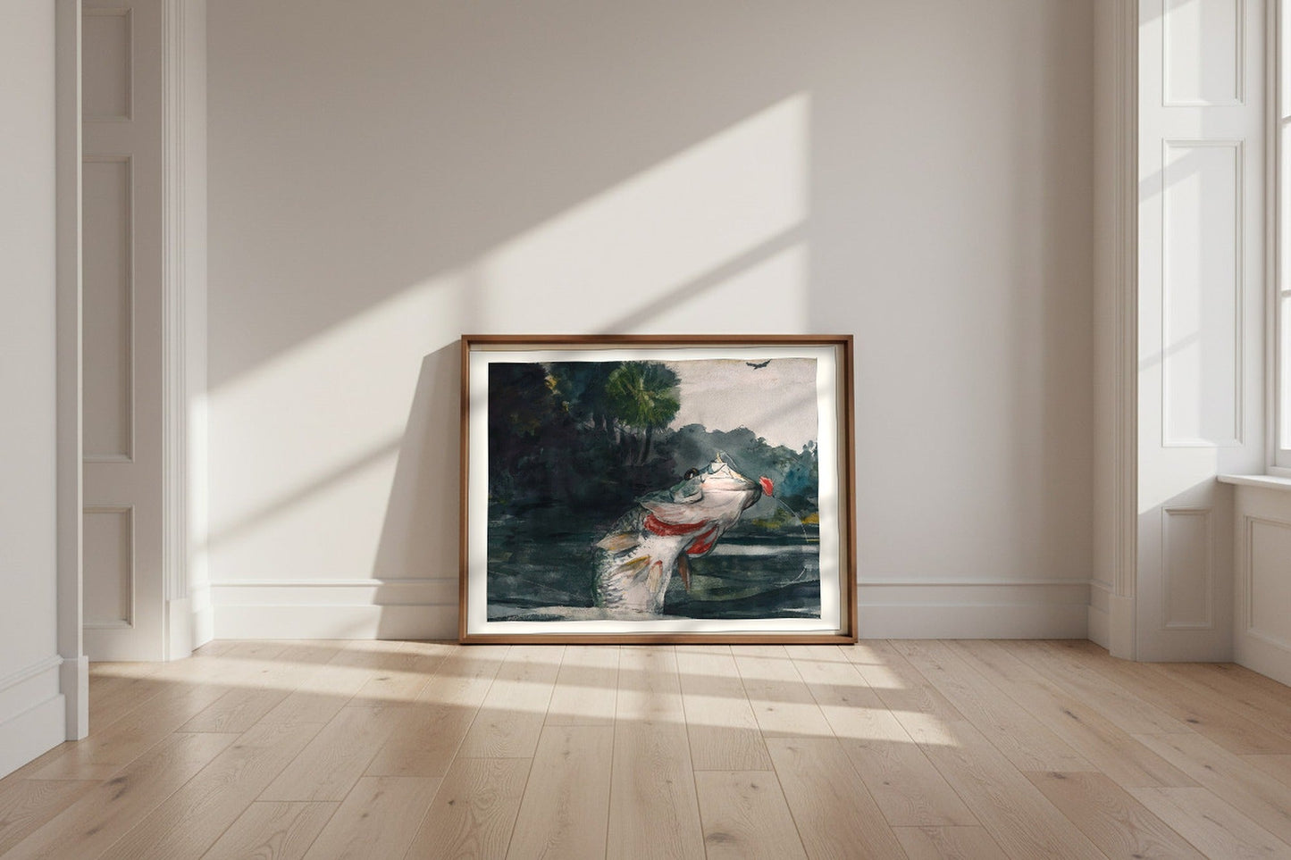Life-Size Black Bass — Winslow Homer Fine Art Poster shown framed and leaning against a wall in a sunlit room