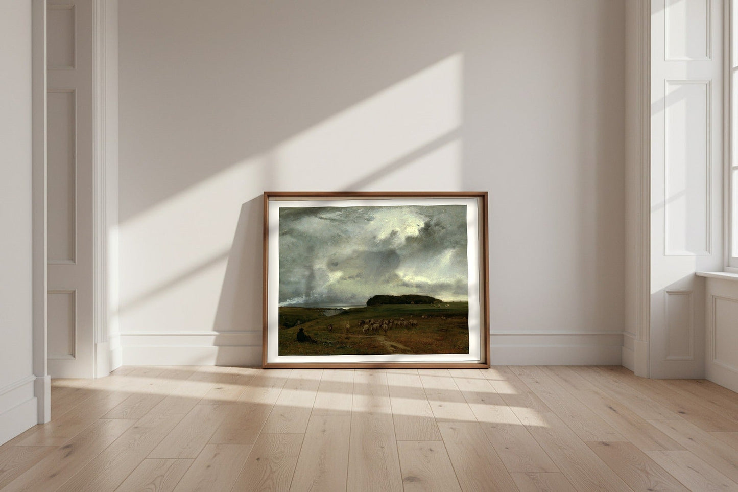 The Storm — George Inness Fine Art Poster shown framed and leaning against a wall in a sunlit room