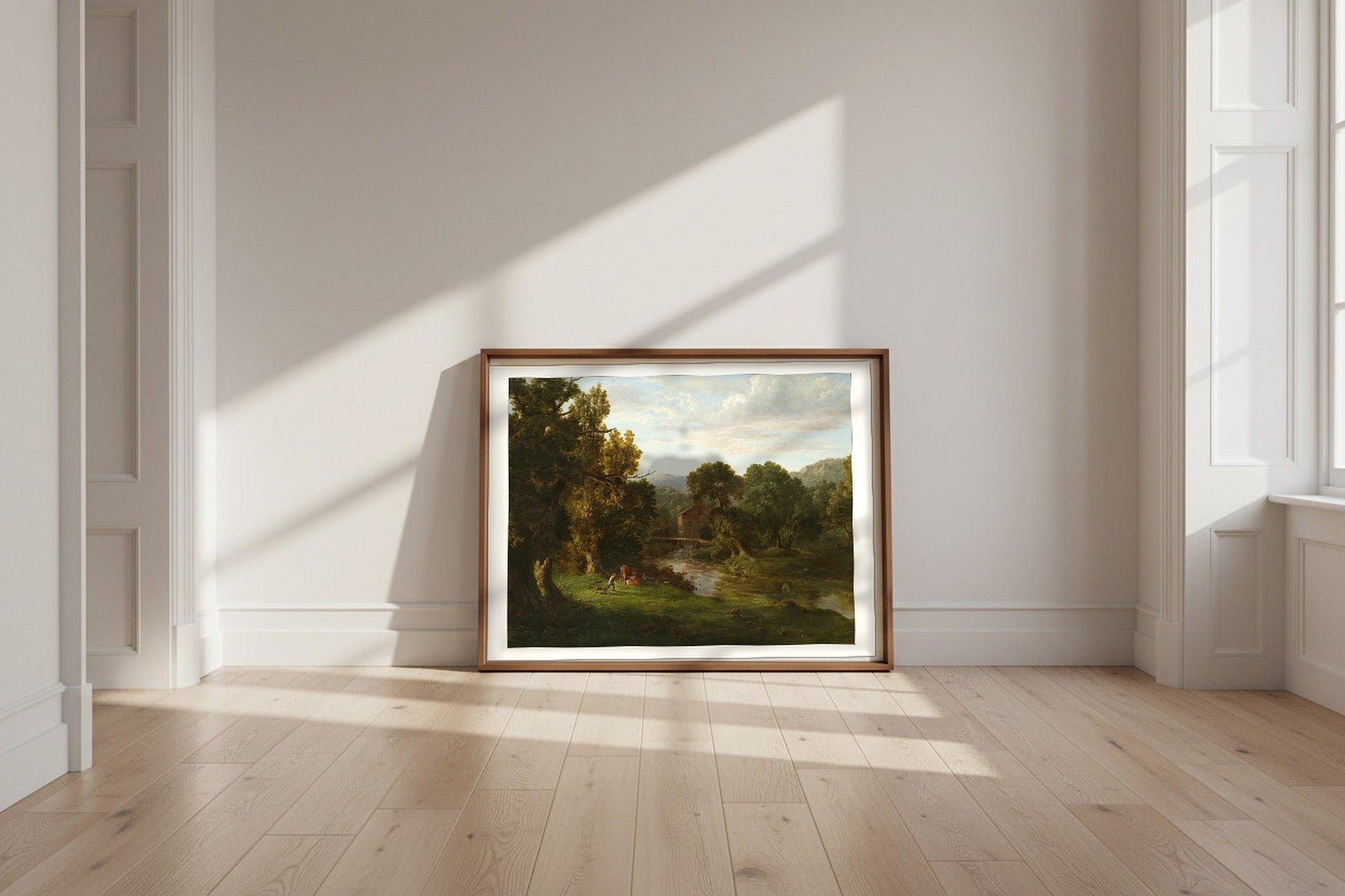 The Old Mill — George Inness Fine Art Poster shown framed and leaning against a wall in a sunlit room