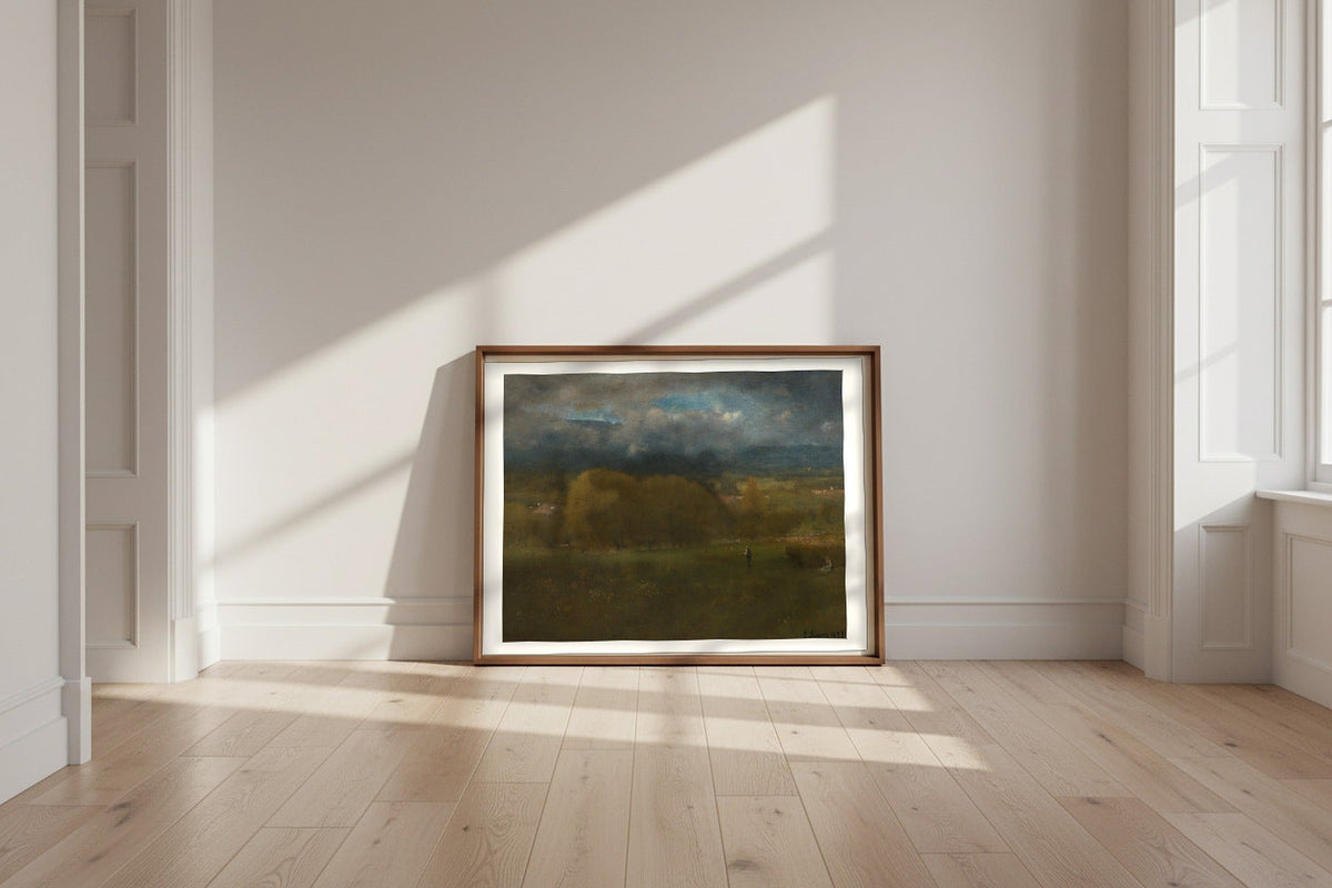 Sunlit Valley — George Inness Fine Art Poster shown framed and leaning against a wall in a sunlit room