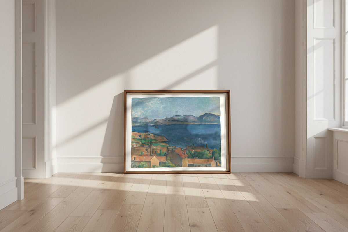 The Bay of Marseille, Seen from L'Estaque — Paul Cézanne Fine Art Poster shown framed and leaning against a wall in a sunlit room