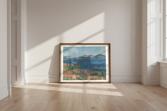The Bay of Marseille, Seen from L'Estaque — Paul Cézanne Fine Art Poster shown framed and leaning against a wall in a sunlit room