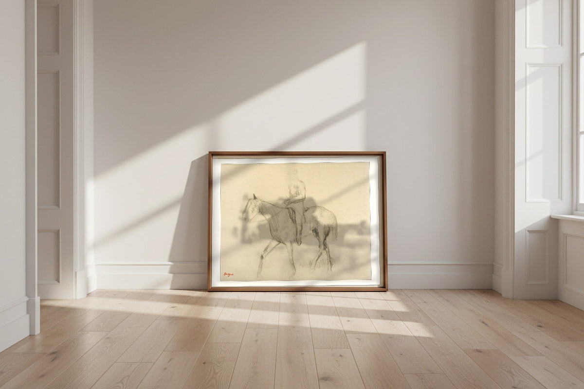Horse and Rider — Edgar Degas Fine Art Poster shown framed and leaning against a wall in a sunlit room