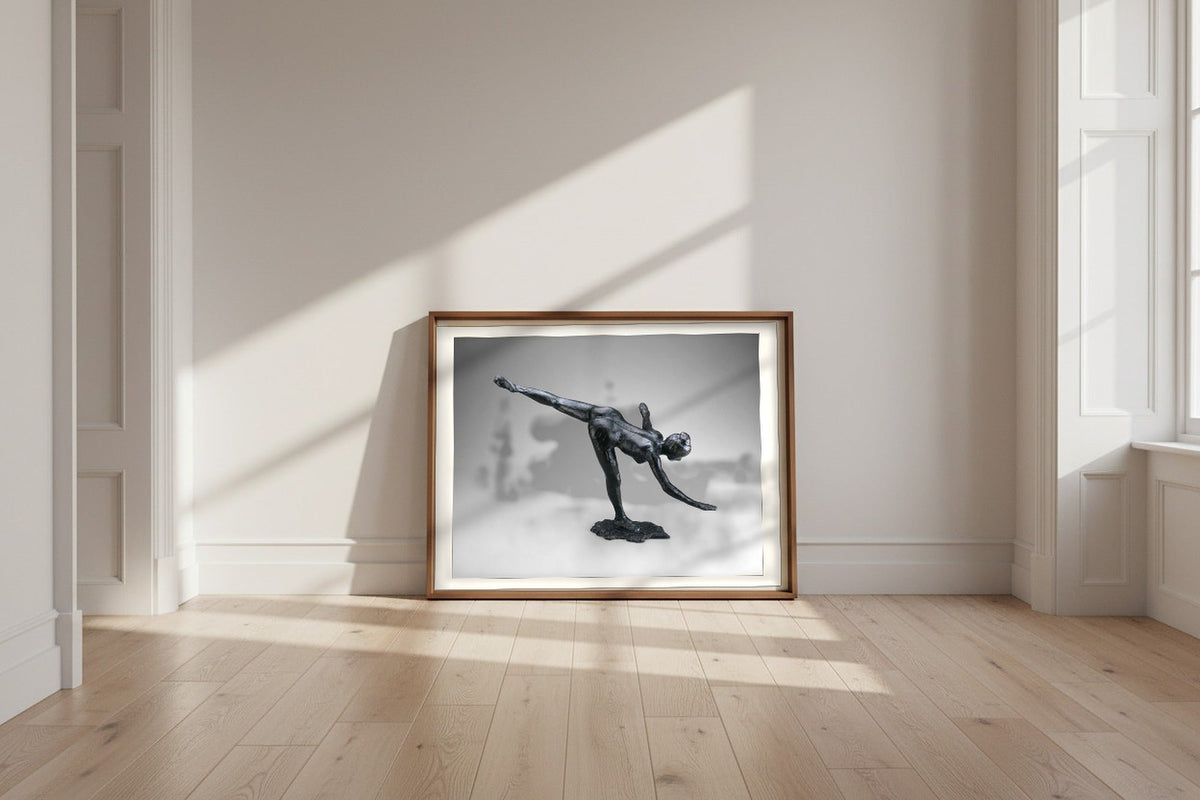 Arabesque — Edgar Degas Fine Art Poster shown framed and leaning against a wall in a sunlit room