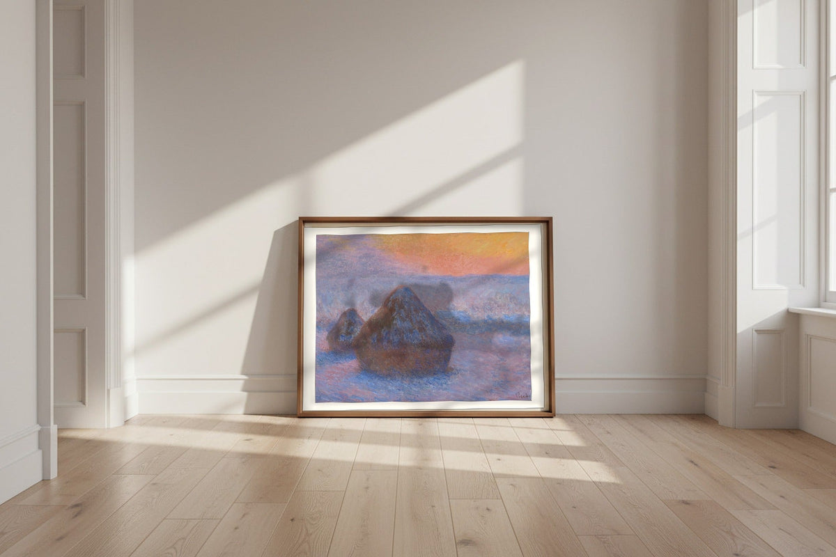 Stacks of Wheat (Sunset, Snow Effect) — Claude Monet Fine Art Poster shown framed and leaning against a wall in a sunlit room