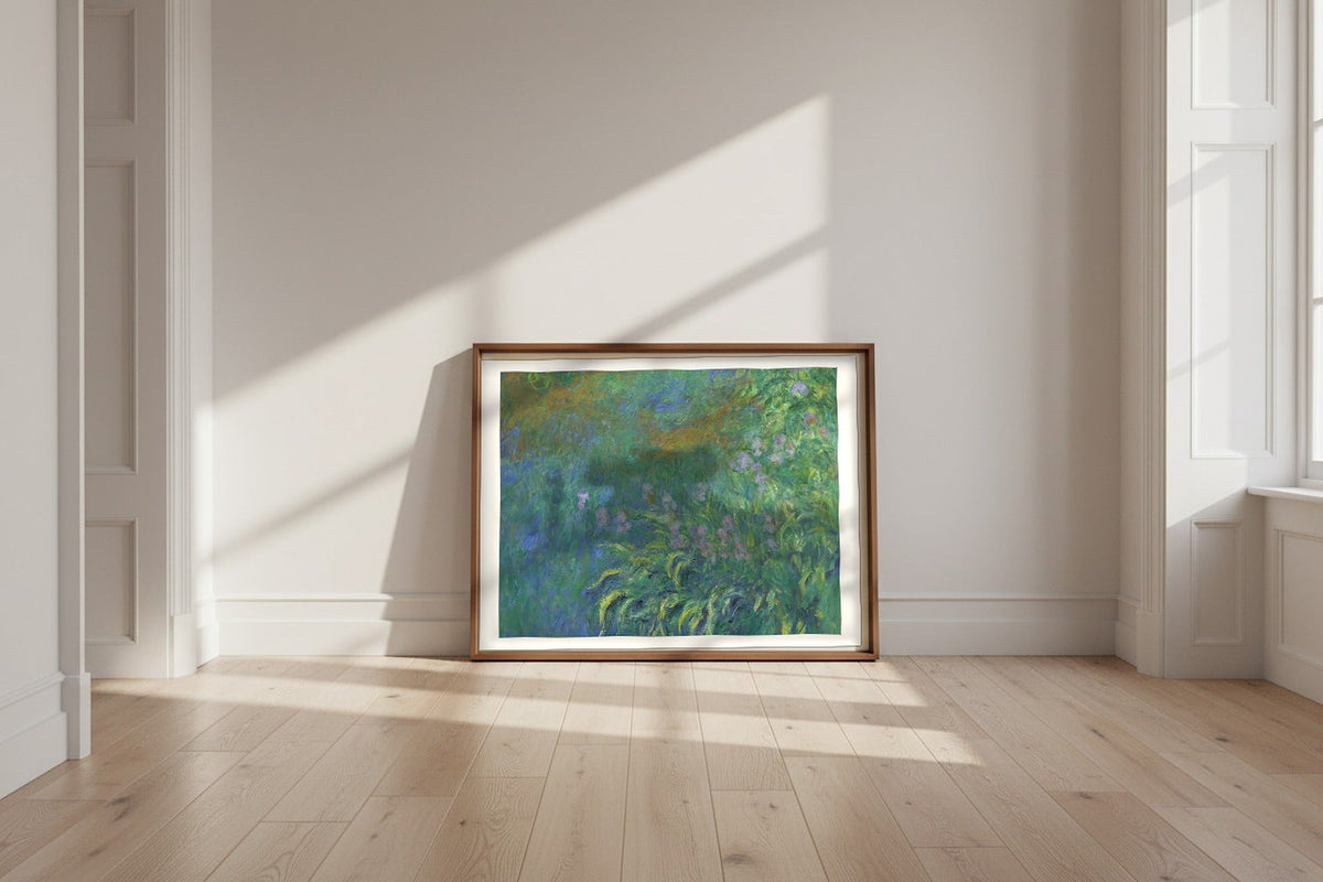 Irises — Claude Monet Fine Art Poster shown framed and leaning against a wall in a sunlit room