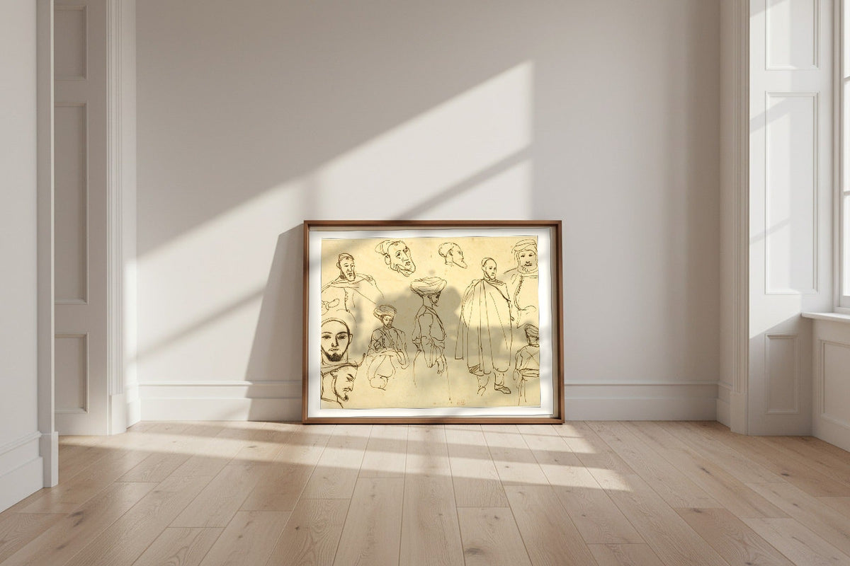 Sketches of Algerian Men — Eugène Delacroix Fine Art Poster shown framed and leaning against a wall in a sunlit room