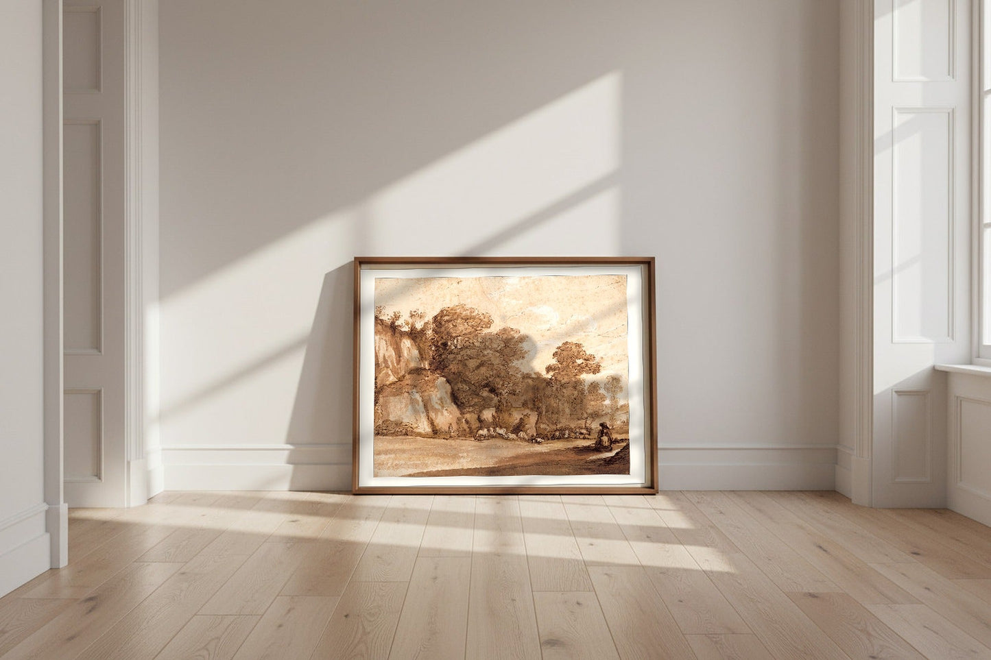 A Rocky Hillside — Claude Lorrain Fine Art Poster shown framed and leaning against a wall in a sunlit room