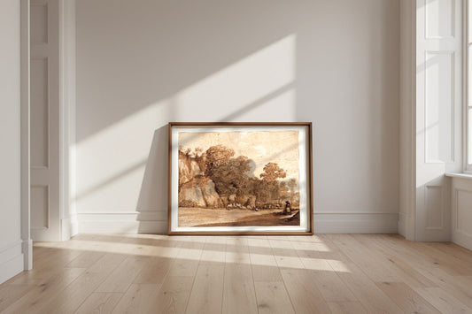 A Rocky Hillside — Claude Lorrain Fine Art Poster shown framed and leaning against a wall in a sunlit room