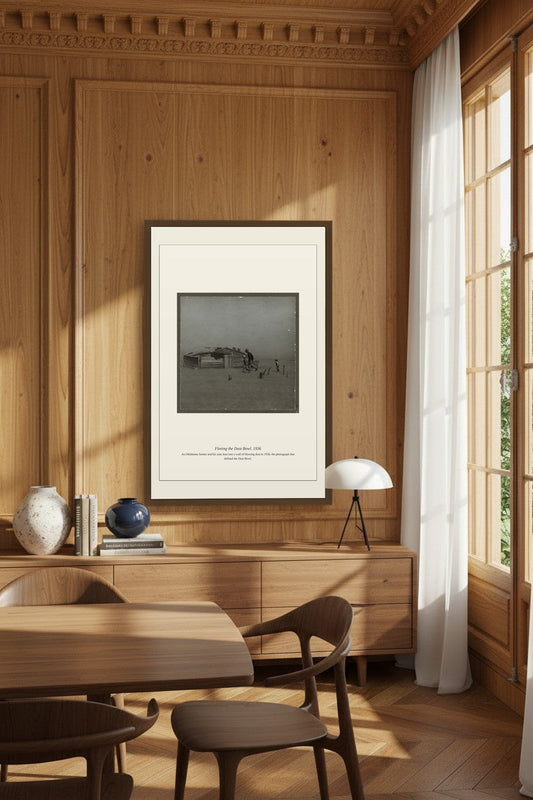 Framed Fleeing the Dust Bowl photograph on a wood-paneled dining room wall above a sideboard