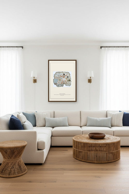 Framed Fowling in the Marshes print between wall sconces above a light sectional sofa