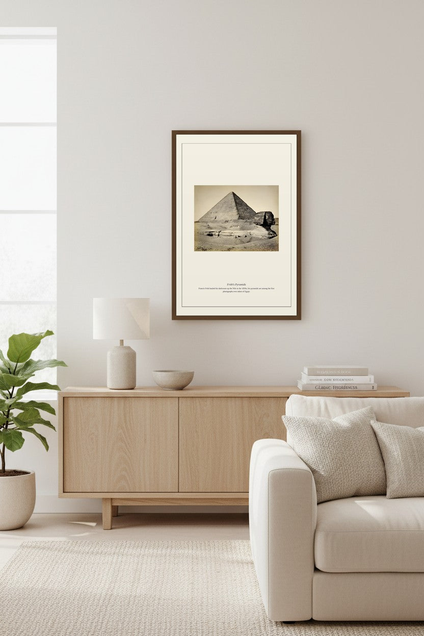 Frith's Pyramids sepia photo framed above a light wood sideboard