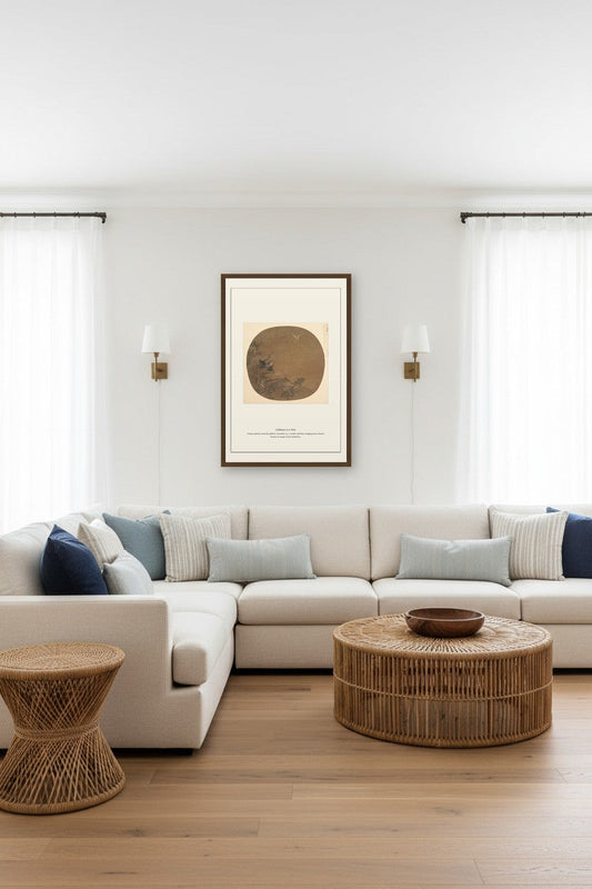 Framed Gibbons in a Tree painting above a beige sectional sofa between curtained windows