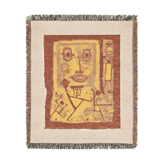 God of War woven throw blanket flat lay, cream fringe border, rust and golden-yellow abstract design