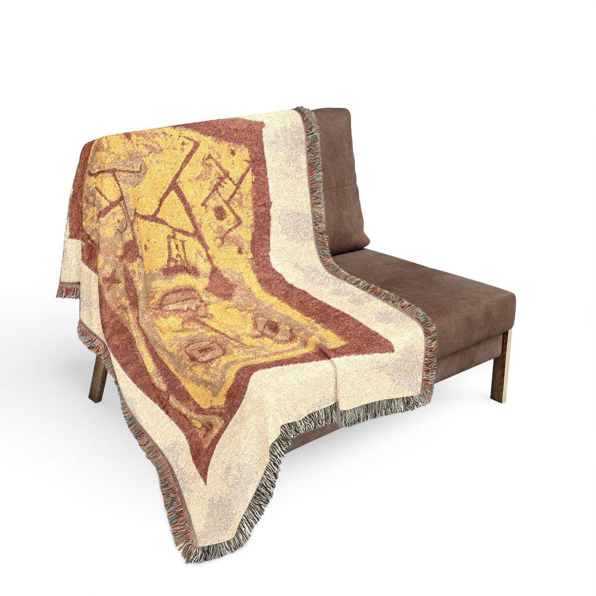 God of War woven throw blanket over sofa back, golden-yellow and rust abstract design with cream fringe border
