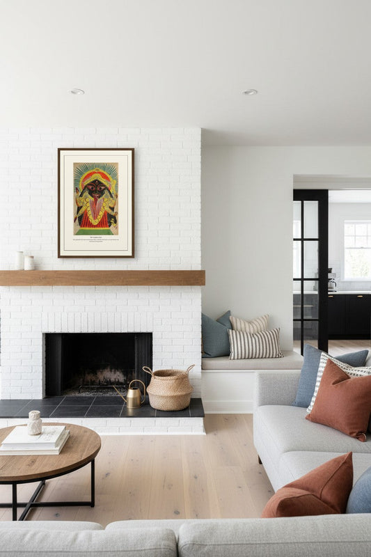 The Goddess Kali painting framed above a white brick fireplace mantel in a living room