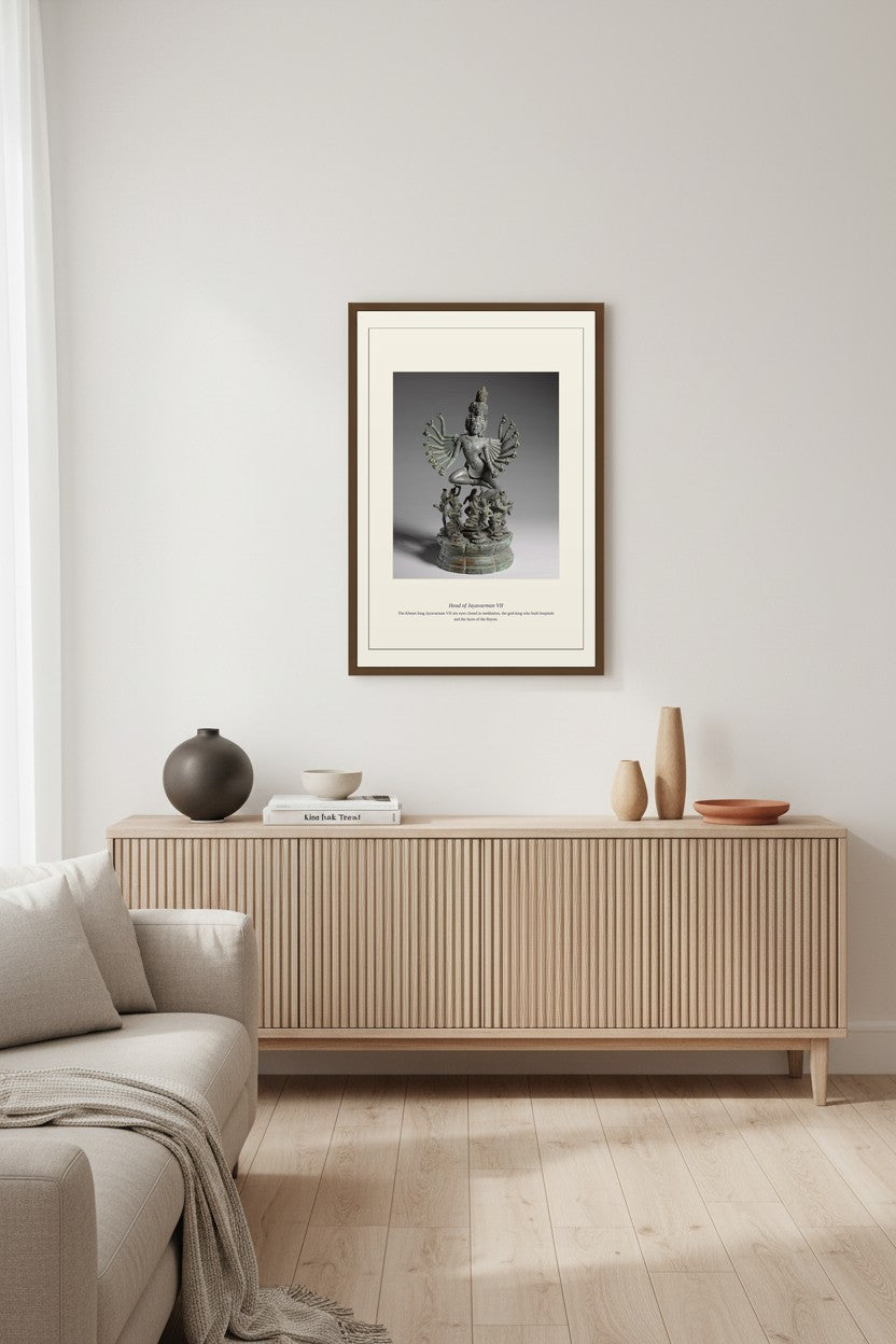 Head of Jayavarman VII framed above a light wood sideboard