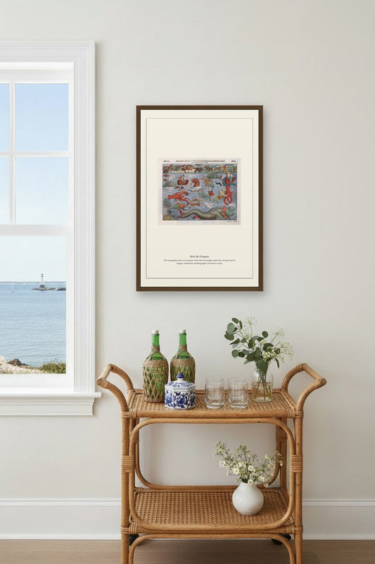 Antique dragon map print framed above a rattan bar cart by a coastal window