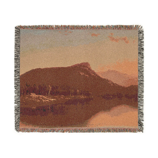 A Home in the Wilderness woven throw blanket flat lay, mountain landscape with lake reflection and warm peach sky