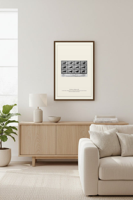 Framed Horse in Motion photography series above a white brick fireplace and sectional sofa