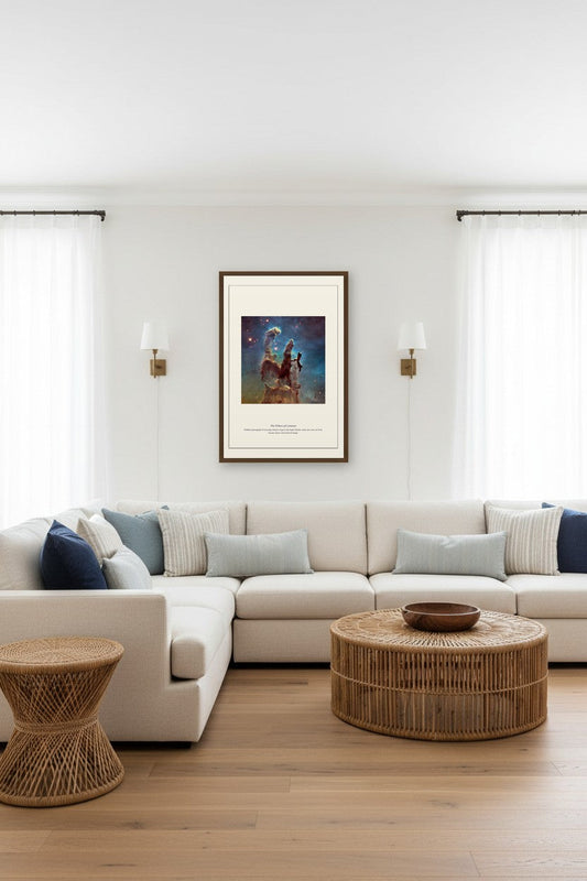 framed Pillars of Creation nebula print above a wooden desk between built-in bookshelves in a home office