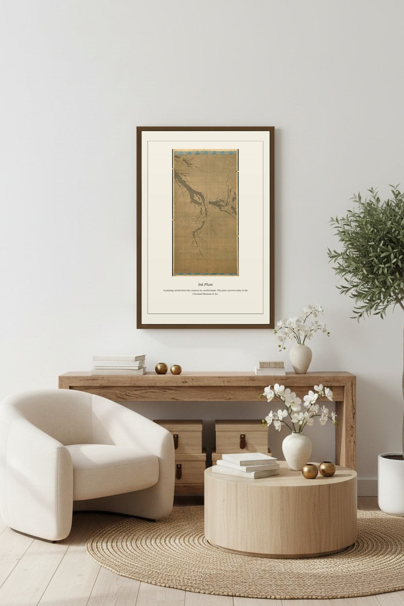 Ink Plum print framed above a wooden console table beside a cream armchair