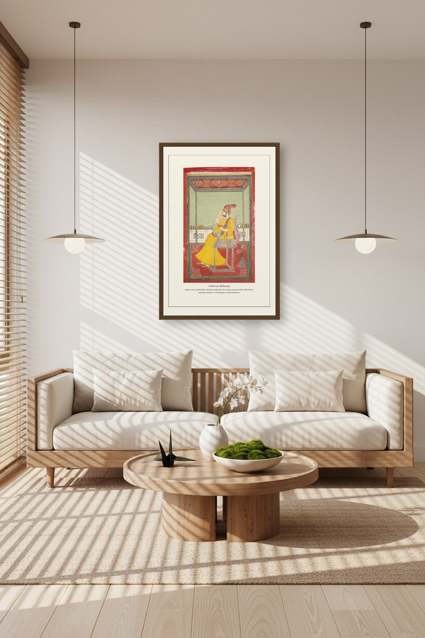 A Marwar Maharaja print framed above a linen sofa beneath pendant lights in a sunlit living room