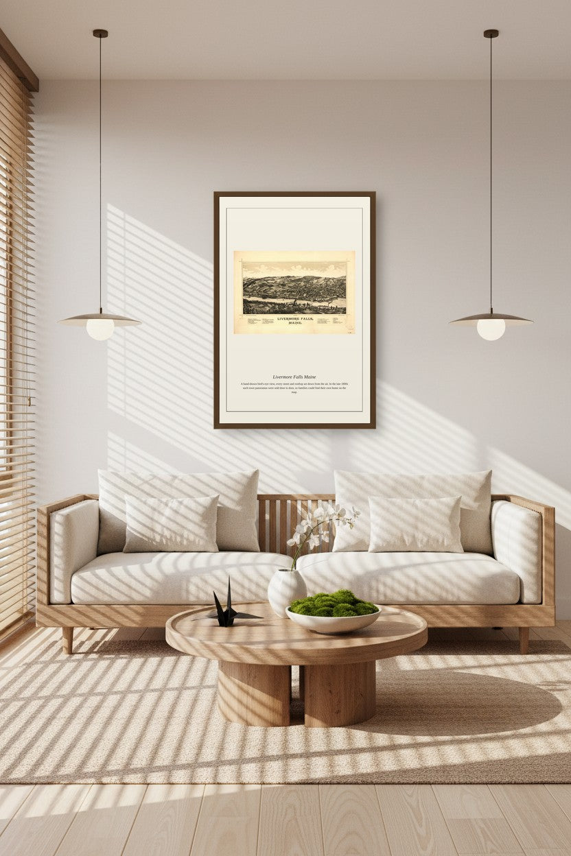Livermore Falls Maine antique map framed between two pendant lights above a sunlit wooden sofa