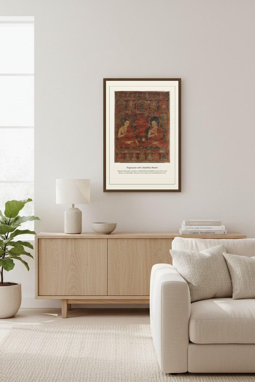 Nagarjuna with a Buddhist Master thangka framed above a light wood sideboard beside a potted fig tree
