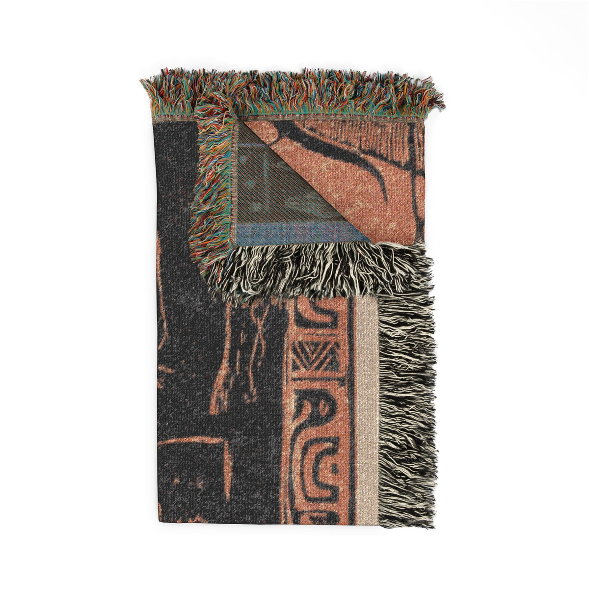 Nave Nave Fenua Woven Throw Blanket folded corner, lush tropical Gauguin floral with back weave visible, fringe accent