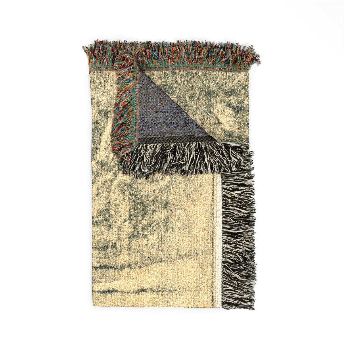 Noa Noa Woven Throw Blanket folded corner, dark forest and upraised arm with back weave visible, fringe accent