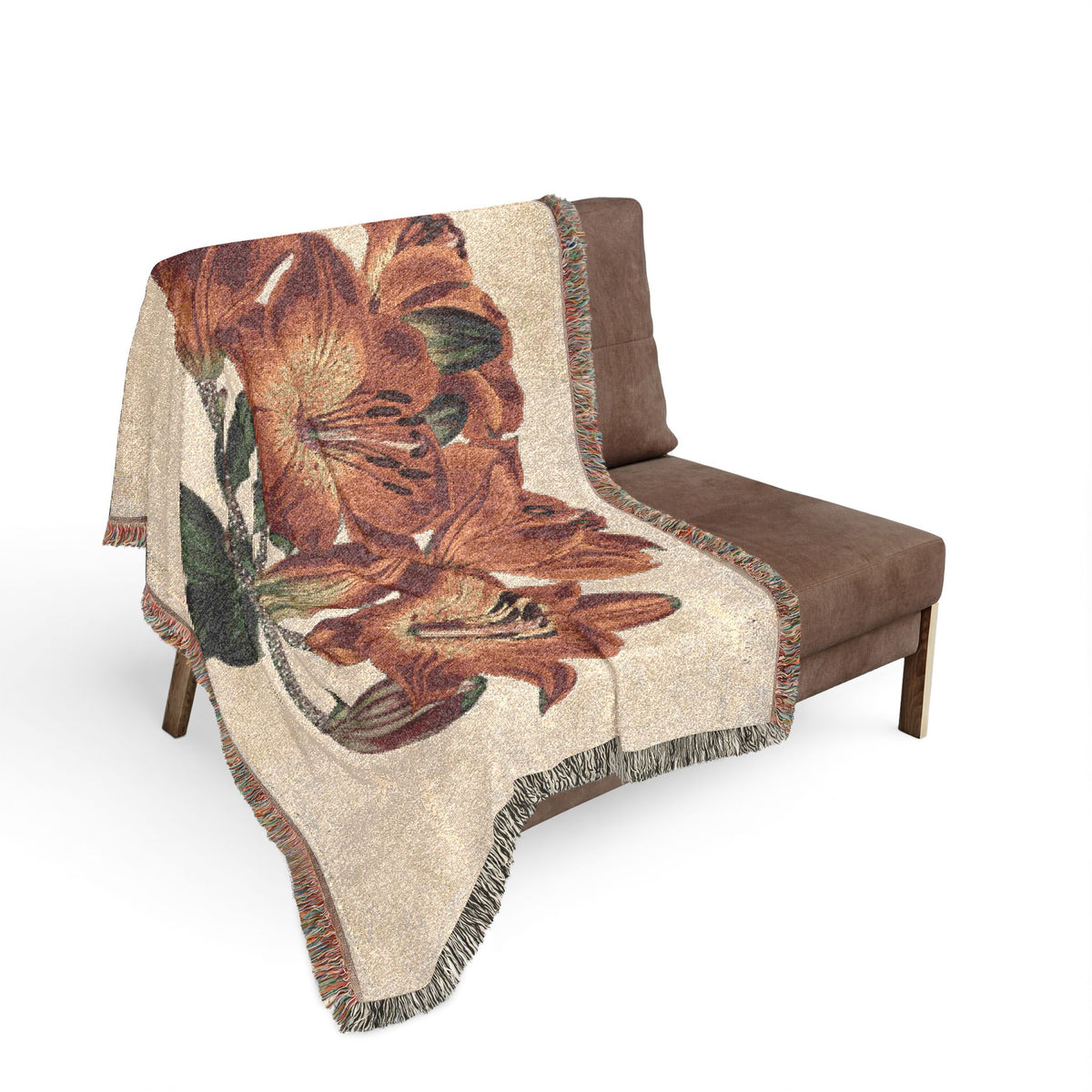 Orange-Lily Botanical blanket on gray sofa, large orange lily botanical art with green leaves on cream background, fringe