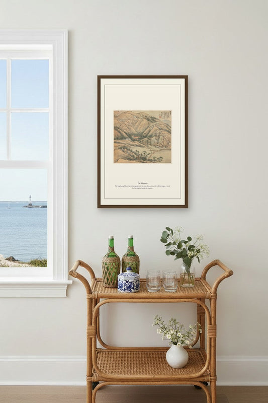 The Phoenix landscape print framed above a rattan bar cart by a coastal window