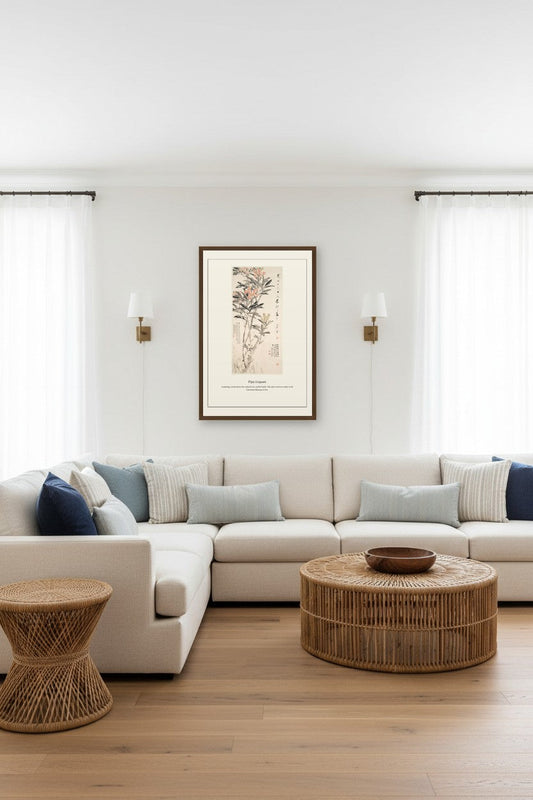 Framed Pipa Loquats painting above a beige sofa between two wall sconces